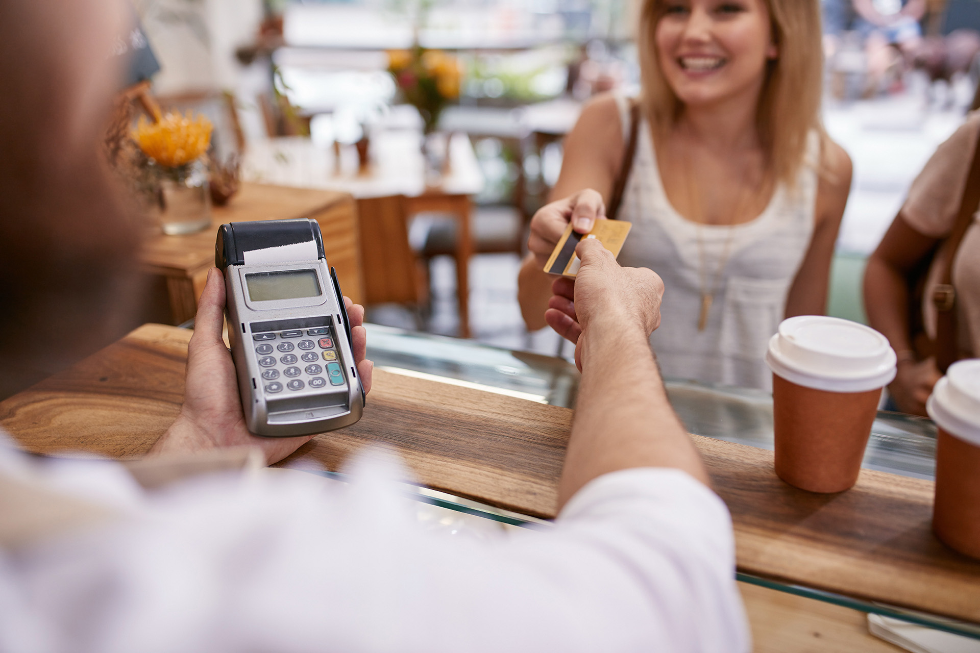 Customer paying at a cafe with credit card